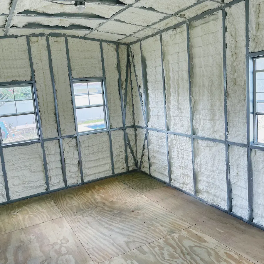 Closed-cell spray foam insulation applied to wall cavities in a residential project in Stockbridge