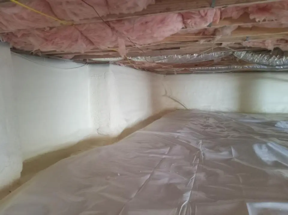 Crawl space encapsulation with closed-cell spray foam for Storm Damage Roof Repair in Stockbridge